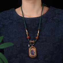 Load image into Gallery viewer, New Intangible Cultural Heritage Gem Painting Thangka Pendant God of Wealth Zakiram Hand-painted Thangka Leather Shell Pendant Single Pendant
